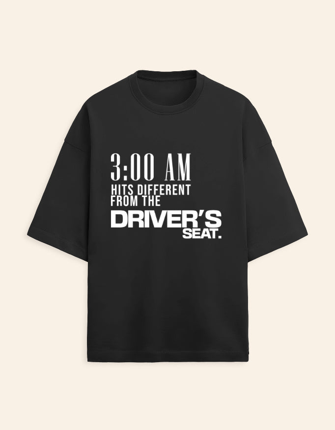 Black t-shirt with white text on a beige background