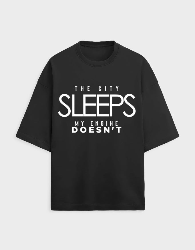 Black t-shirt with white text on a light gray background WITH AUTOMOTIVE QUOTE
