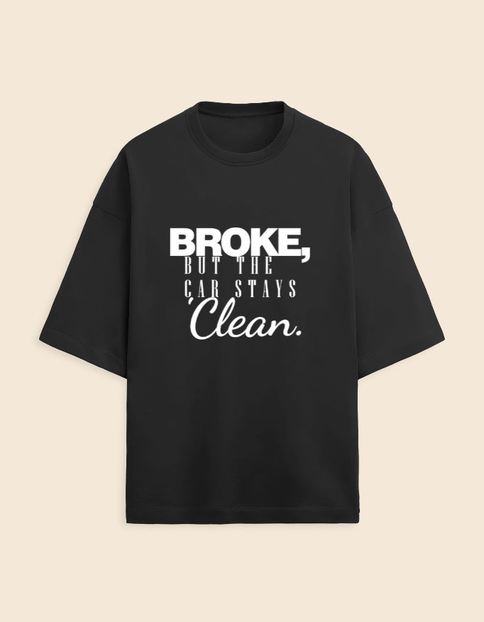 Black t-shirt with white text on a beige background