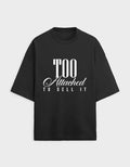 Black t-shirt with white text 'Too Attached To Sell It' on a light gray background